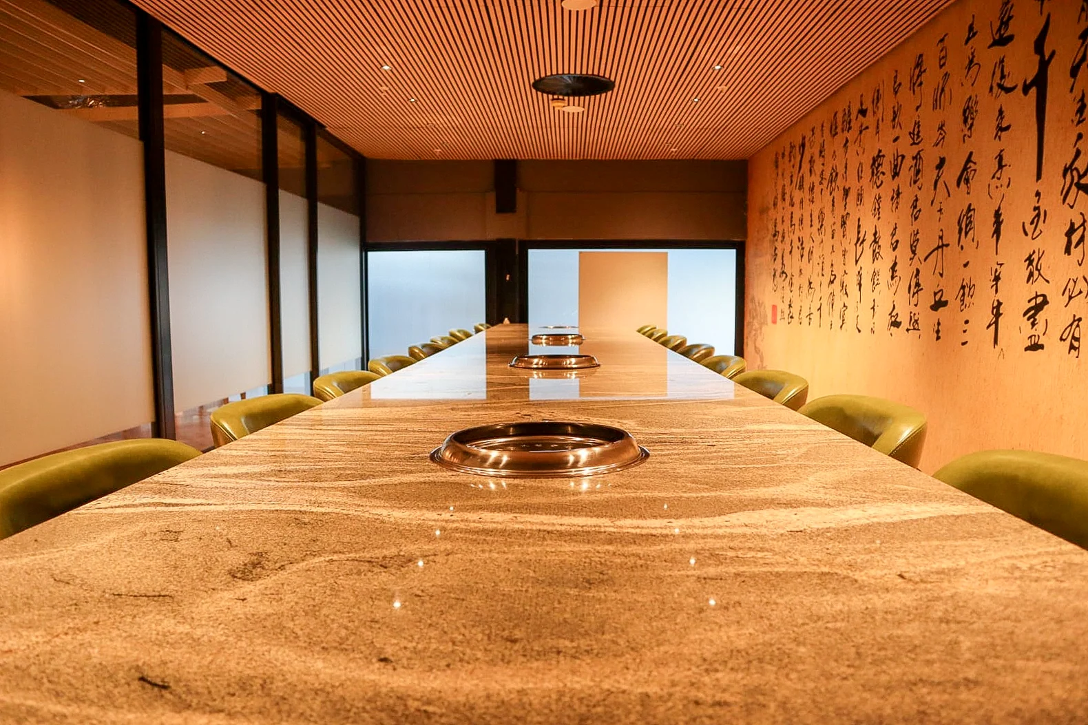 Nine Sky communal dining table and calligraphy feature wall